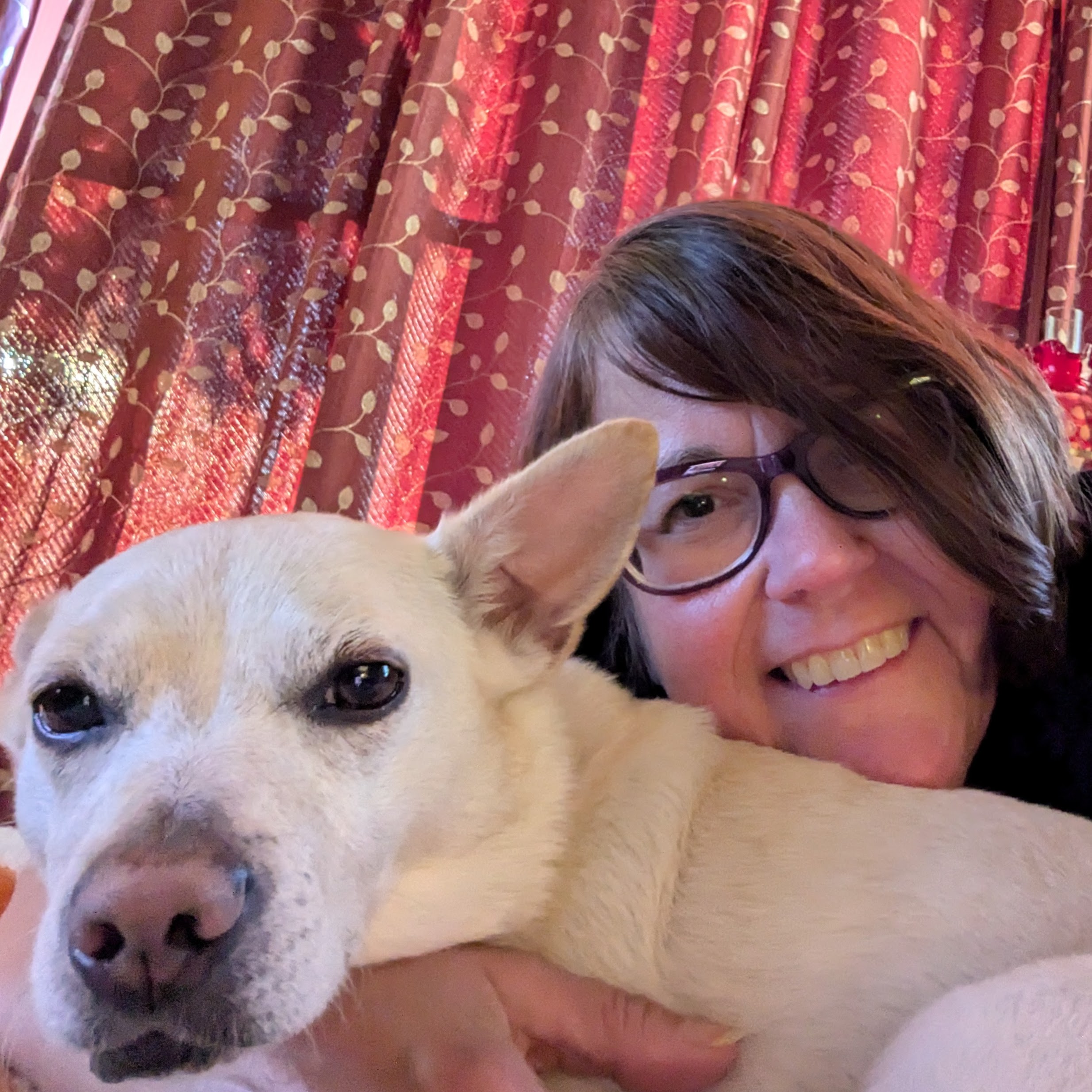 Fantasy author Margaret Feuerman smiling with her dog